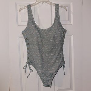 Cute Juniors one piece knit swimsuit with lace up sides. Size XL (15-17)